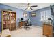 Comfortable bedroom with a ceiling fan, a window, and a bookshelf at 14693 E Crestridge Dr, Aurora, CO 80015