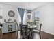 Cozy dining area featuring a round table, stylish chairs, and contemporary decor at 14693 E Crestridge Dr, Aurora, CO 80015