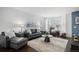 Modern living room offering stylish seating, contemporary decor, and abundant natural light at 14693 E Crestridge Dr, Aurora, CO 80015