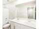 Bright bathroom featuring double sinks, and a shower over tub in a well lit space at 781 N Tempe St, Aurora, CO 80018