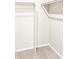 Open walk-in closet with shelving and hanging rods for efficient storage at 781 N Tempe St, Aurora, CO 80018