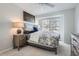 Serene bedroom with natural light and a chest of drawers at 9523 Sherrelwood Ln, Highlands Ranch, CO 80126