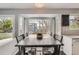 Sun-filled dining area featuring a large window and hardwood floors. Ideal for Gathering gatherings at 9523 Sherrelwood Ln, Highlands Ranch, CO 80126