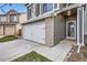 Home with a two-car garage, well kept yard and a front porch with a 