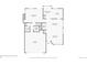 Detailed first floor plan showcasing the layout of a house with a kitchen, living and dining areas, and garage at 9523 Sherrelwood Ln, Highlands Ranch, CO 80126