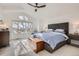 Bright main bedroom featuring large window, vaulted ceiling and ample natural light at 9523 Sherrelwood Ln, Highlands Ranch, CO 80126
