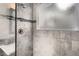 Walk-in shower features mosaic accent tile, a built-in bench, and a frosted window at 9523 Sherrelwood Ln, Highlands Ranch, CO 80126