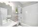 Modern bathroom with vanity, bright lights, and a bathtub shower combination with white tiling at 4144 Tennyson St # 212, Denver, CO 80212
