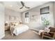 Bright bedroom featuring neutral tones, tray with book and plant on the bed, and decorative art at 4144 Tennyson St # 212, Denver, CO 80212