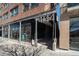 Modern brick building featuring sleek architectural details and prominent street-facing signage at 4144 Tennyson St # 212, Denver, CO 80212