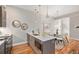 Sleek kitchen with island, stainless steel appliances, and pendant lighting, connected to the dining area at 4144 Tennyson St # 212, Denver, CO 80212