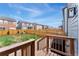 Backyard features a wood fence, grass area, and deck with a grill for outdoor entertaining at 19121 E 65Th Ave, Denver, CO 80249