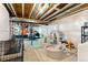 Unfinished basement area converted into a play area at 19121 E 65Th Ave, Denver, CO 80249