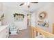 Cozy Bedroom featuring a rocking chair, books and decorations at 19121 E 65Th Ave, Denver, CO 80249