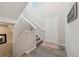 Bright entryway featuring a staircase with white railing and modern flooring at 19121 E 65Th Ave, Denver, CO 80249