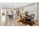 Open kitchen features stone counter tops, a round table, and stainless appliances at 19121 E 65Th Ave, Denver, CO 80249