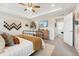 Inviting main bedroom with stylish furniture, large dresser, and calming decor at 19121 E 65Th Ave, Denver, CO 80249