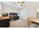 Home office with wood desk, desk chair, 3 monitors and a view of the carpet at 19121 E 65Th Ave, Denver, CO 80249