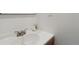 Close-up of a sink and faucet highlighting clean lines and simplicity in a brightly lit bathroom space at 575 2Nd St, Bennett, CO 80102