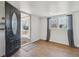 Bright entryway with hardwood floors and a view of the porch at 575 2Nd St, Bennett, CO 80102