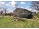 Side view of a quaint single-story home with a well-kept lawn at 575 2Nd St, Bennett, CO 80102