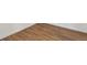 Hardwood flooring with white walls and molding at 575 2Nd St, Bennett, CO 80102