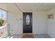 Close-up of the front door with a welcome mat at 575 2Nd St, Bennett, CO 80102