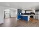 Open-concept kitchen with stainless steel appliances and modern cabinets at 575 2Nd St, Bennett, CO 80102