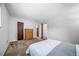 Bedroom with carpet flooring, dresser, closet and view into hallway at 10007 Bryant St, Denver, CO 80260