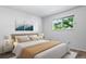 Bedroom with carpet flooring, a window with a view, fresh paint and side tables at 10007 Bryant St, Denver, CO 80260