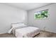 Bedroom with carpet flooring, a window with a view and fresh paint at 10007 Bryant St, Denver, CO 80260