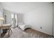 Bedroom with carpet flooring, a desk, a twin bed and a window at 10007 Bryant St, Denver, CO 80260