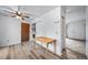 Dining area with luxury vinyl plank flooring, closet and view to the front door at 10007 Bryant St, Denver, CO 80260
