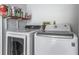 Laundry room with side by side washer and dryer, and shelf space at 10007 Bryant St, Denver, CO 80260