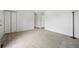 A bright living room features neutral carpet, and the freshly painted white walls enhance the sense of space at 10007 Bryant St, Denver, CO 80260