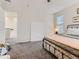 A spacious bedroom featuring soft carpet and a view into the hall at 4862 S Piccadilly Ct, Aurora, CO 80015