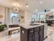 Bright kitchen featuring an island, stainless steel appliances, and an adjacent dining area for Gathering meals at 4862 S Piccadilly Ct, Aurora, CO 80015
