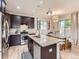 Modern kitchen boasts granite countertops, stainless steel appliances, and a spacious island at 4862 S Piccadilly Ct, Aurora, CO 80015