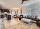 Open-concept living space flows seamlessly into a modern kitchen, complete with stylish decor and plenty of natural light at 4862 S Piccadilly Ct, Aurora, CO 80015