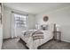 Bedroom with a large window and modern decor at 5648 S Youngfield Way, Littleton, CO 80127