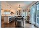Charming dining area with a table, chairs, and sliding glass doors offering lots of natural light at 5648 S Youngfield Way, Littleton, CO 80127