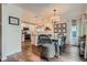 Stylish dining room area connected to the kitchen, featuring a modern table and pendant lighting at 5648 S Youngfield Way, Littleton, CO 80127