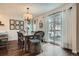 Dining room with a table and chairs, chandelier, and sliding glass doors to an outdoor space at 5648 S Youngfield Way, Littleton, CO 80127