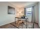 Cozy home office featuring natural light, modern desk and chair, and neutral decor for a productive workspace at 5648 S Youngfield Way, Littleton, CO 80127
