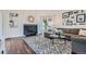 Bright living room with a modern fireplace, stylish rug, and comfortable seating arrangement at 5648 S Youngfield Way, Littleton, CO 80127