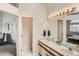 Dual sink bathroom with a large mirror and modern fixtures at 187 W Prestwick Ct, Castle Rock, CO 80104