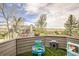 Home deck featuring outdoor toys, green artificial turf, and partial views of surrounding landscape at 187 W Prestwick Ct, Castle Rock, CO 80104