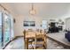 Bright dining room with chandelier lighting, adjacent to the living room at 187 W Prestwick Ct, Castle Rock, CO 80104