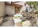 Inviting front entrance with stone accent walls and manicured landscaping at 187 W Prestwick Ct, Castle Rock, CO 80104