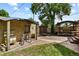 Backyard view of brick building with adjacent outdoor kitchen at 2716 N Vine St, Denver, CO 80205